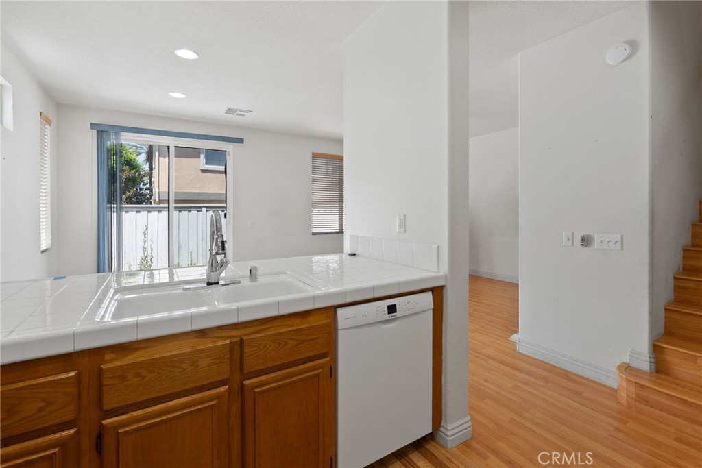 17887 Lilac Court Carson, CA 90746 - Photo 13 of 48 a bathroom with a granite countertop sink and a mirror