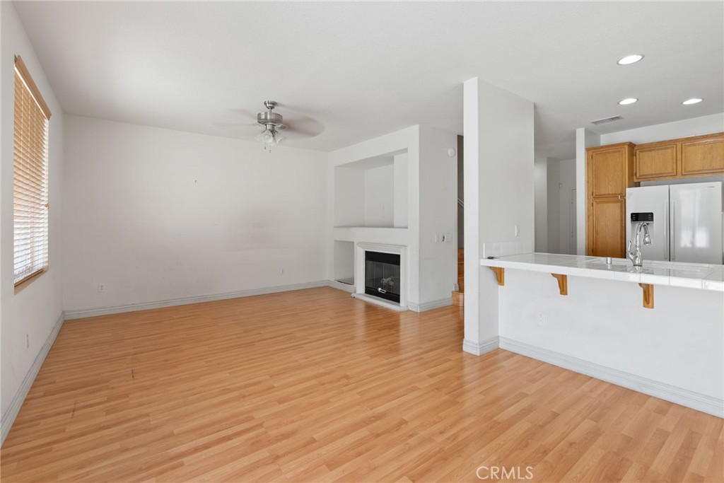 17887 Lilac Court Carson, CA 90746 - Photo 14 of 48 wooden floor in an empty room with a kitchen