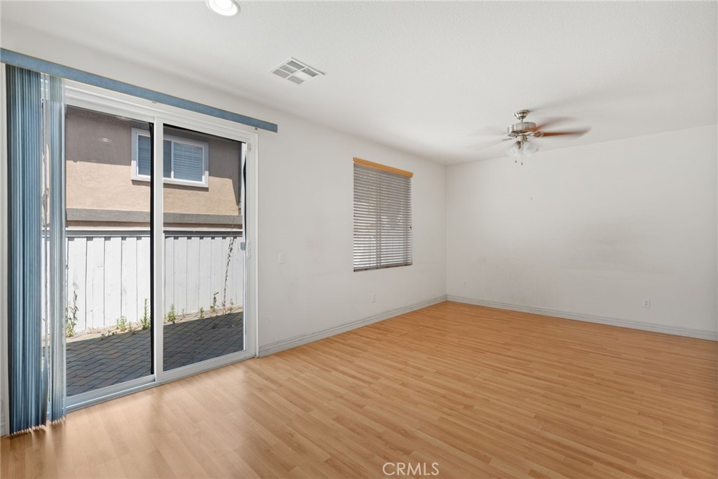 17887 Lilac Court Carson, CA 90746 - Photo 18 of 48 wooden floor in an empty room with a window
