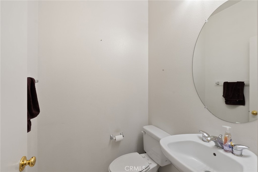 17887 Lilac Court Carson, CA 90746 - Photo 19 of 48 a bathroom with a sink and mirror with toilet