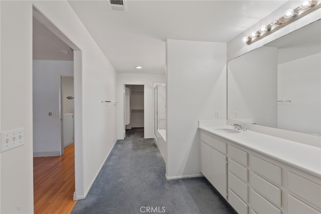 17887 Lilac Court Carson, CA 90746 - Photo 26 of 48 a bathroom with a double vanity sink and mirror