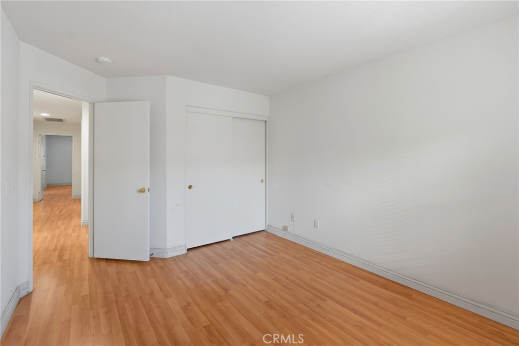 17887 Lilac Court Carson, CA 90746 - Photo 31 of 48 a view of an empty room with wooden floor