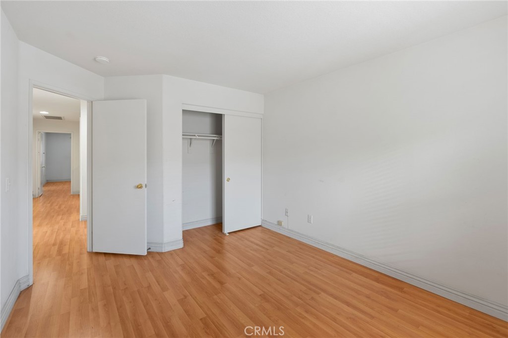 17887 Lilac Court Carson, CA 90746 - Photo 32 of 48 a view of an empty room with wooden floor
