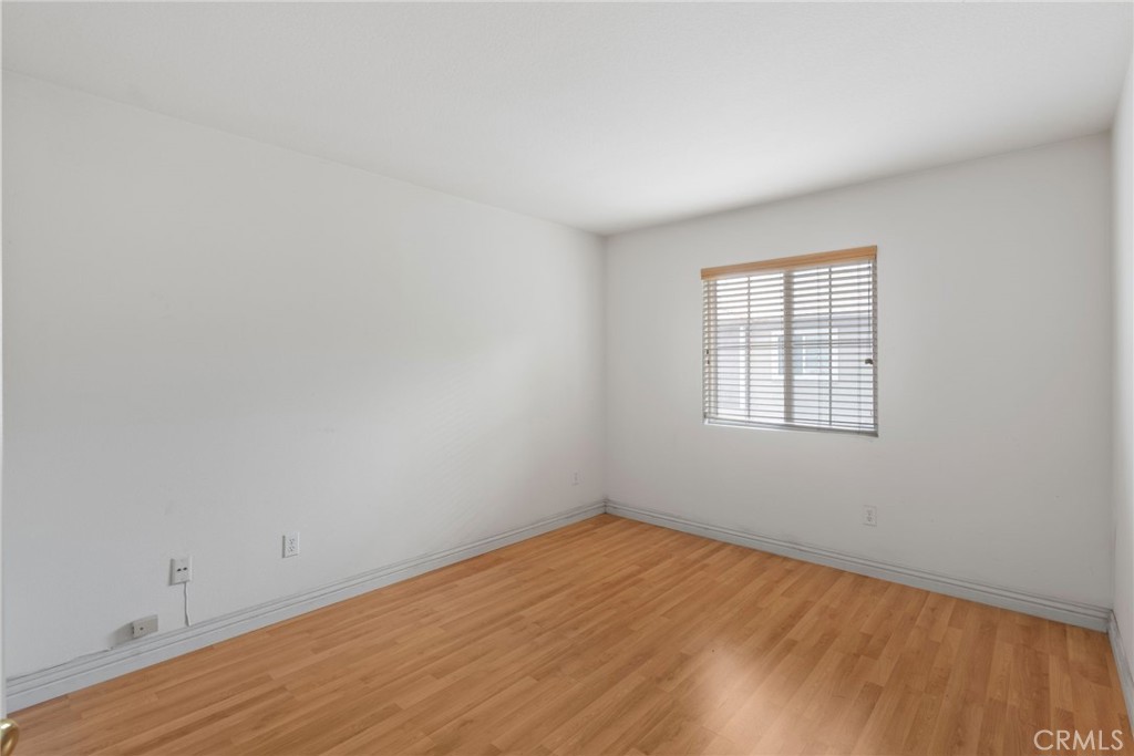 17887 Lilac Court Carson, CA 90746 - Photo 33 of 48 wooden floor in an empty room with a window
