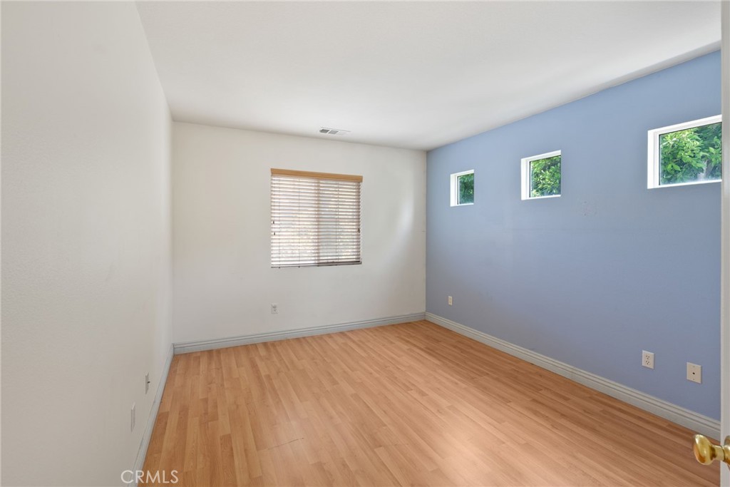 17887 Lilac Court Carson, CA 90746 - Photo 37 of 48 wooden floor in an empty room with a window