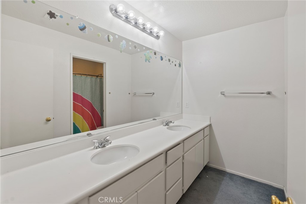 17887 Lilac Court Carson, CA 90746 - Photo 39 of 48 a bathroom with a double vanity sink and a mirror