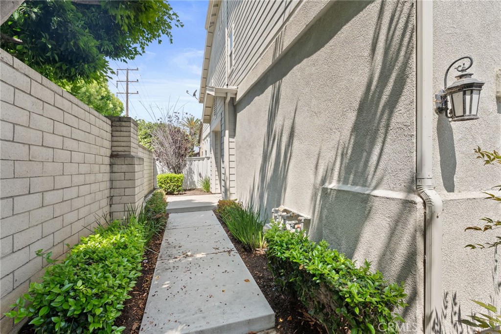 17887 Lilac Court Carson, CA 90746 - Photo 6 of 48 a view of a pathway with flower plants