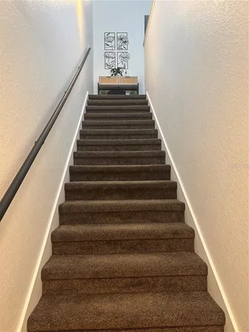 a kitchen with a sink a stove and refrigerator