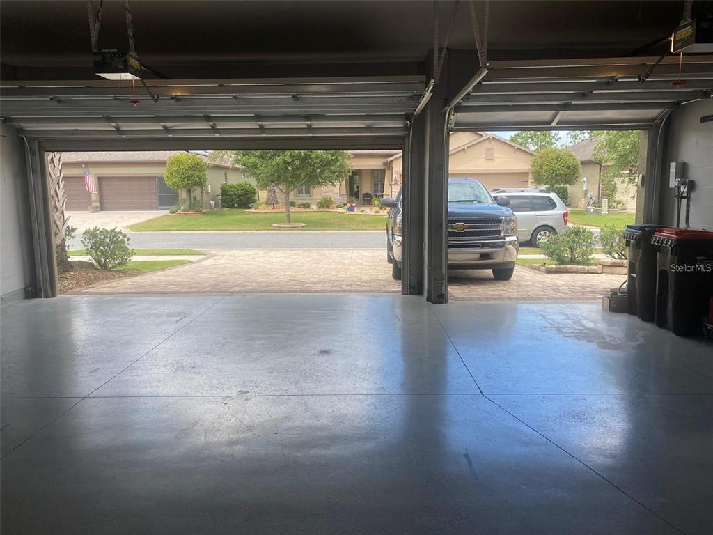10041 Southwest 77th Loop Ocala, FL 34481 - Photo 27 of 39 a view of empty room with wooden floor and floor to ceiling window