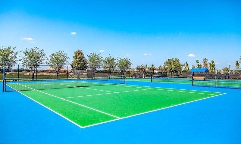 10041 Southwest 77th Loop Ocala, FL 34481 - Photo 37 of 39 a view of an outdoor space and tennis court