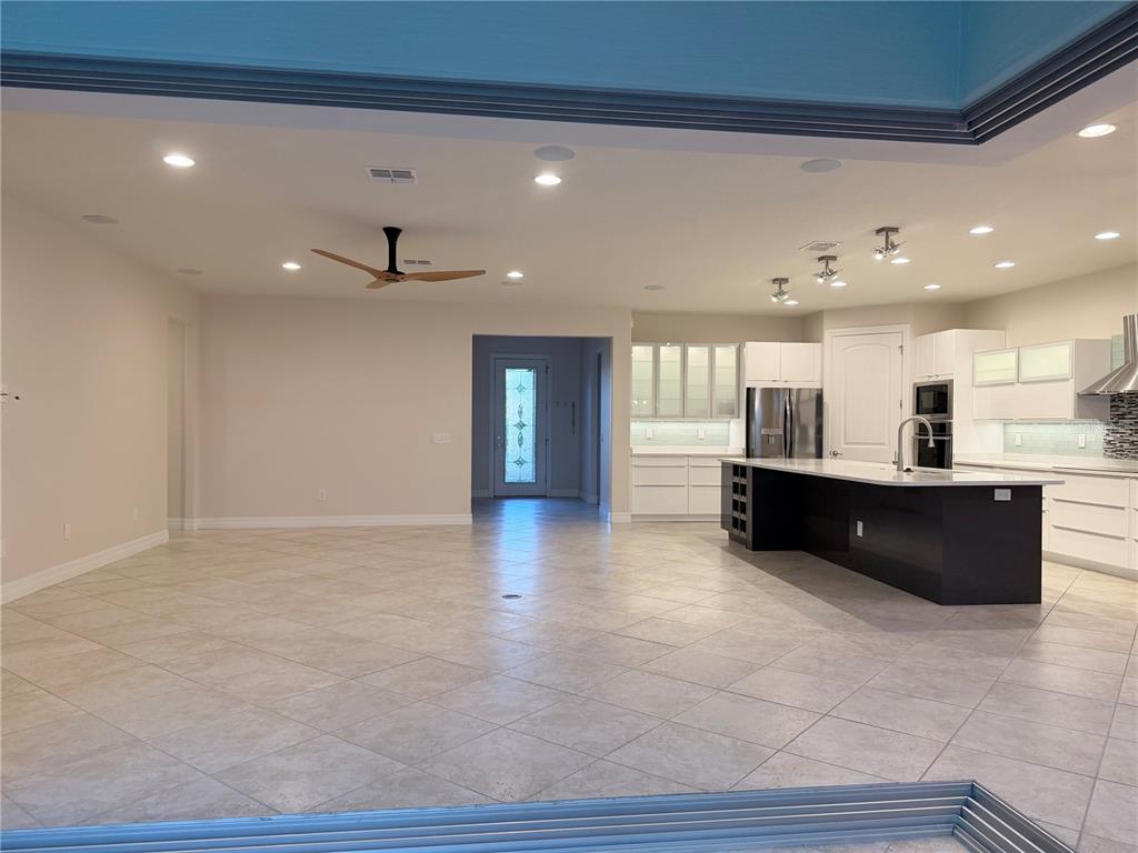 10041 Southwest 77th Loop Ocala, FL 34481 - Photo 10 of 39 a living room with furniture and a table