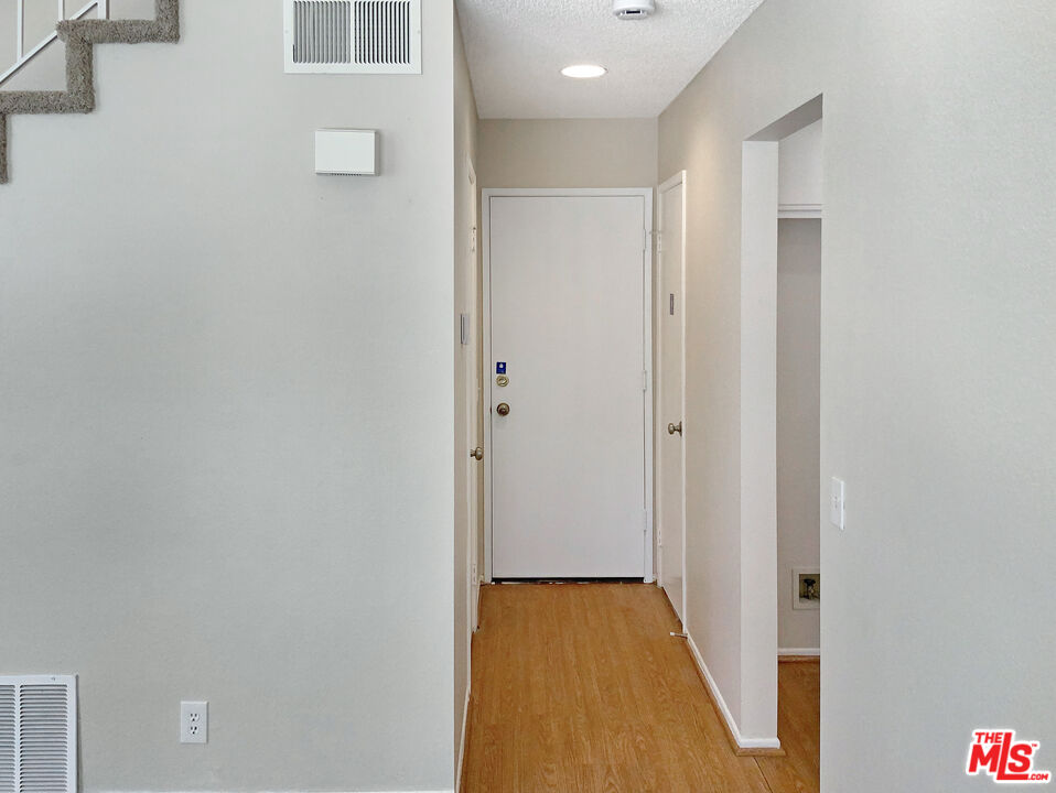 11074 Kenyon Way Rancho Cucamonga, CA 91701 - Photo 14 of 28 a view of hallway with wooden floor