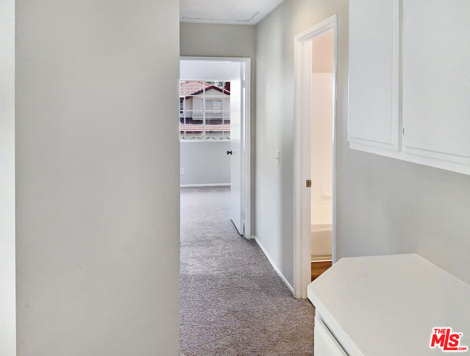 11074 Kenyon Way Rancho Cucamonga, CA 91701 - Photo 16 of 28 a view of a room with an empty space and a hallway