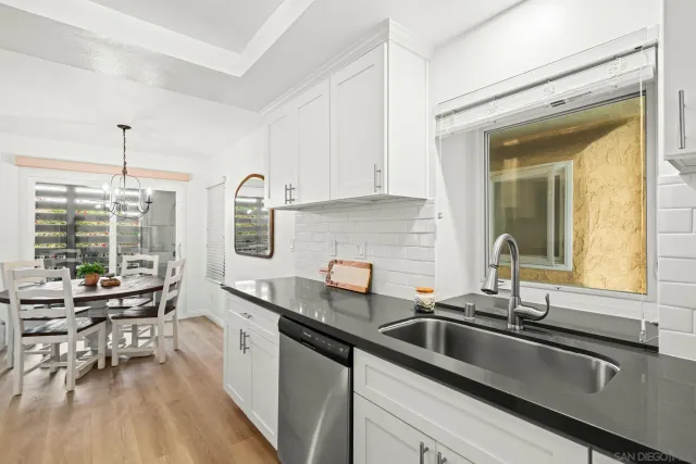 a kitchen with stainless steel appliances a sink and cabinets