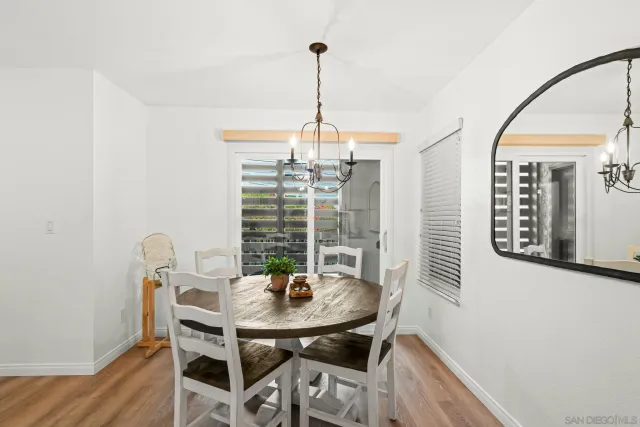 a view of a dining room with furniture and window