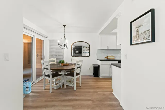 a view of a dining room with furniture and window
