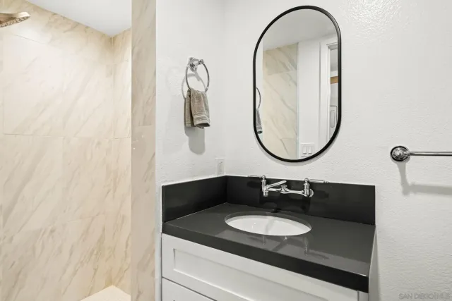 a bathroom with a sink and a mirror