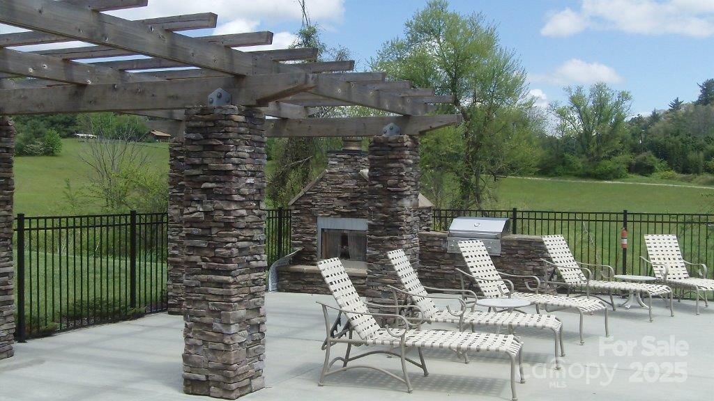 4 Brookstone Place Candler, NC 28715 - Photo 18 of 31 a view of a chairs and table in patio