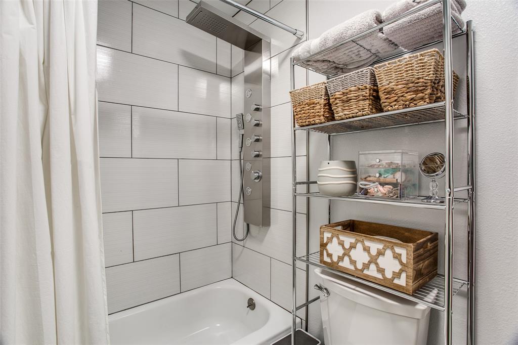 3005 6th Avenue Fort Worth, TX 76110 - Photo 12 of 18 a bathroom with a toilet and a shower