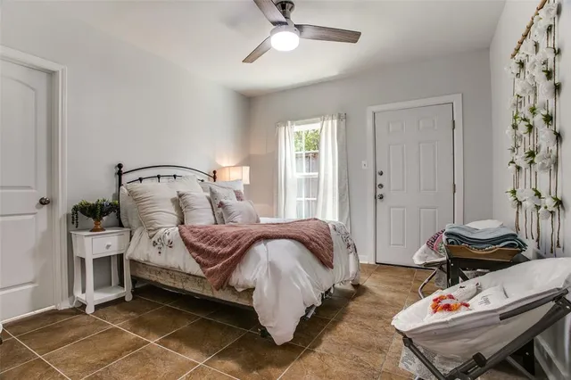 a bedroom with bed and a window