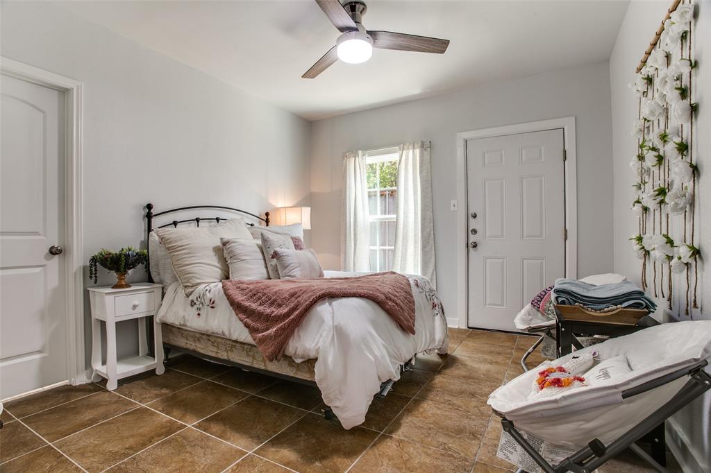 3005 6th Avenue Fort Worth, TX 76110 - Photo 13 of 18 a bedroom with bed and a window