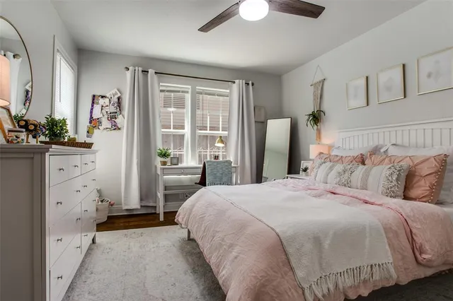 a bedroom with a large bed and a dresser