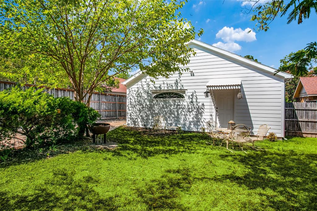 3005 6th Avenue Fort Worth, TX 76110 - Photo 17 of 18 a view of a house with a yard and sitting area