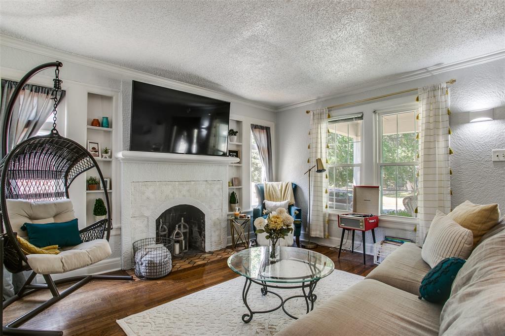 3005 6th Avenue Fort Worth, TX 76110 - Photo 2 of 18 a living room with furniture fireplace and window