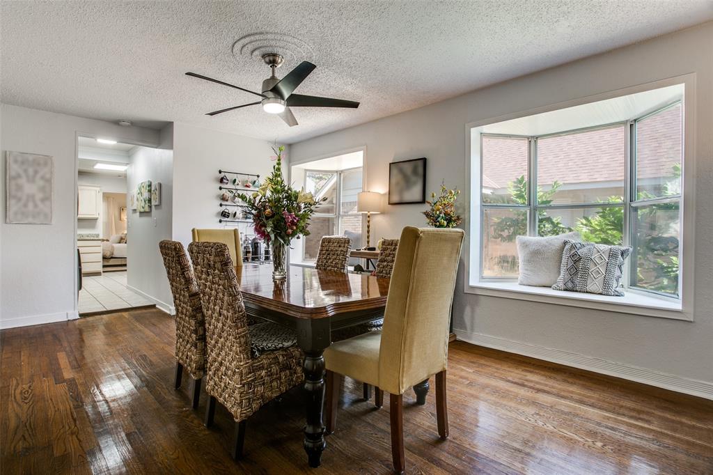 3005 6th Avenue Fort Worth, TX 76110 - Photo 4 of 18 a dining room with furniture window wooden floor