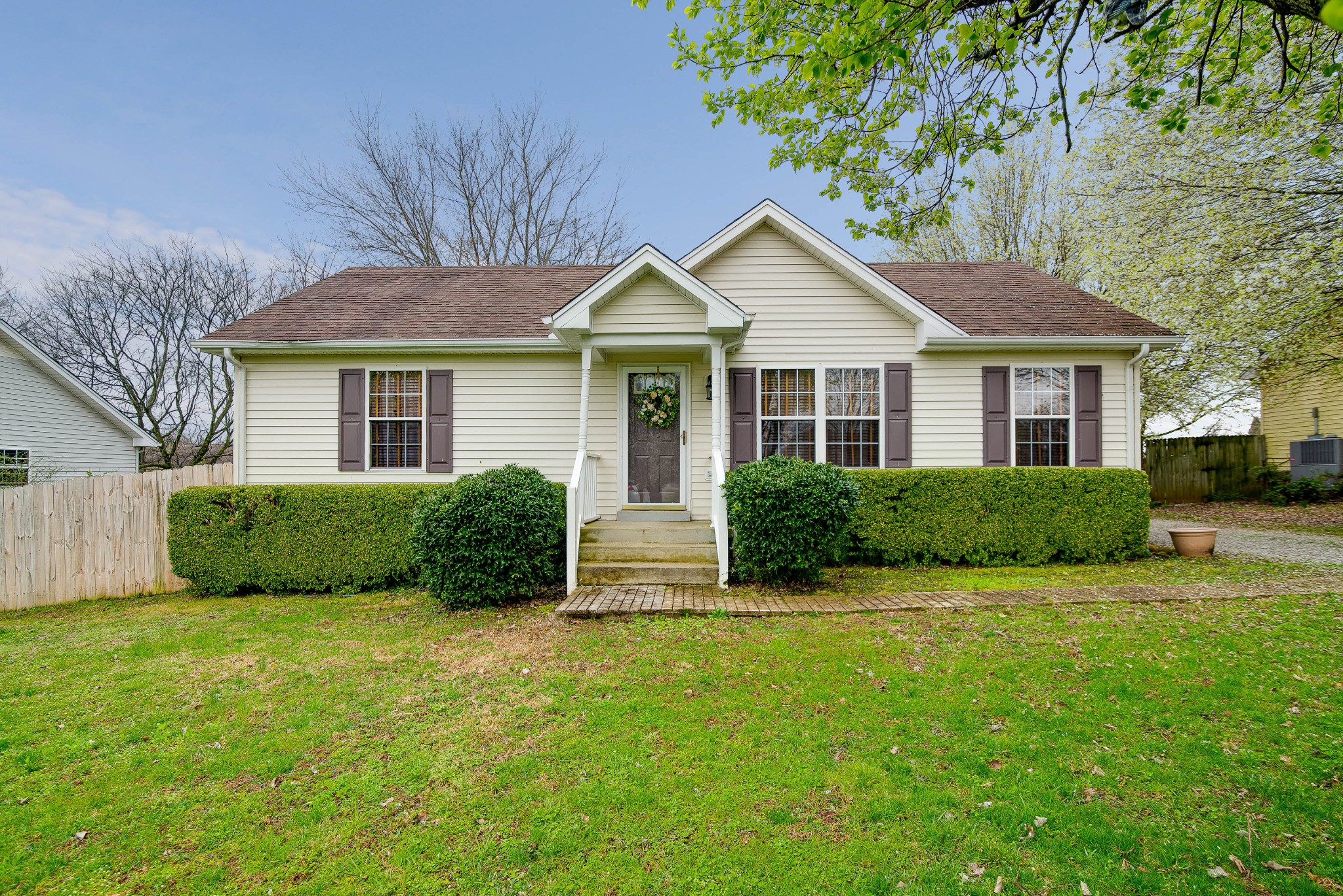 104 Brookside Point Springfield, TN 37172 - Photo 1 of 28 a view of a house next to a yard with plants and trees