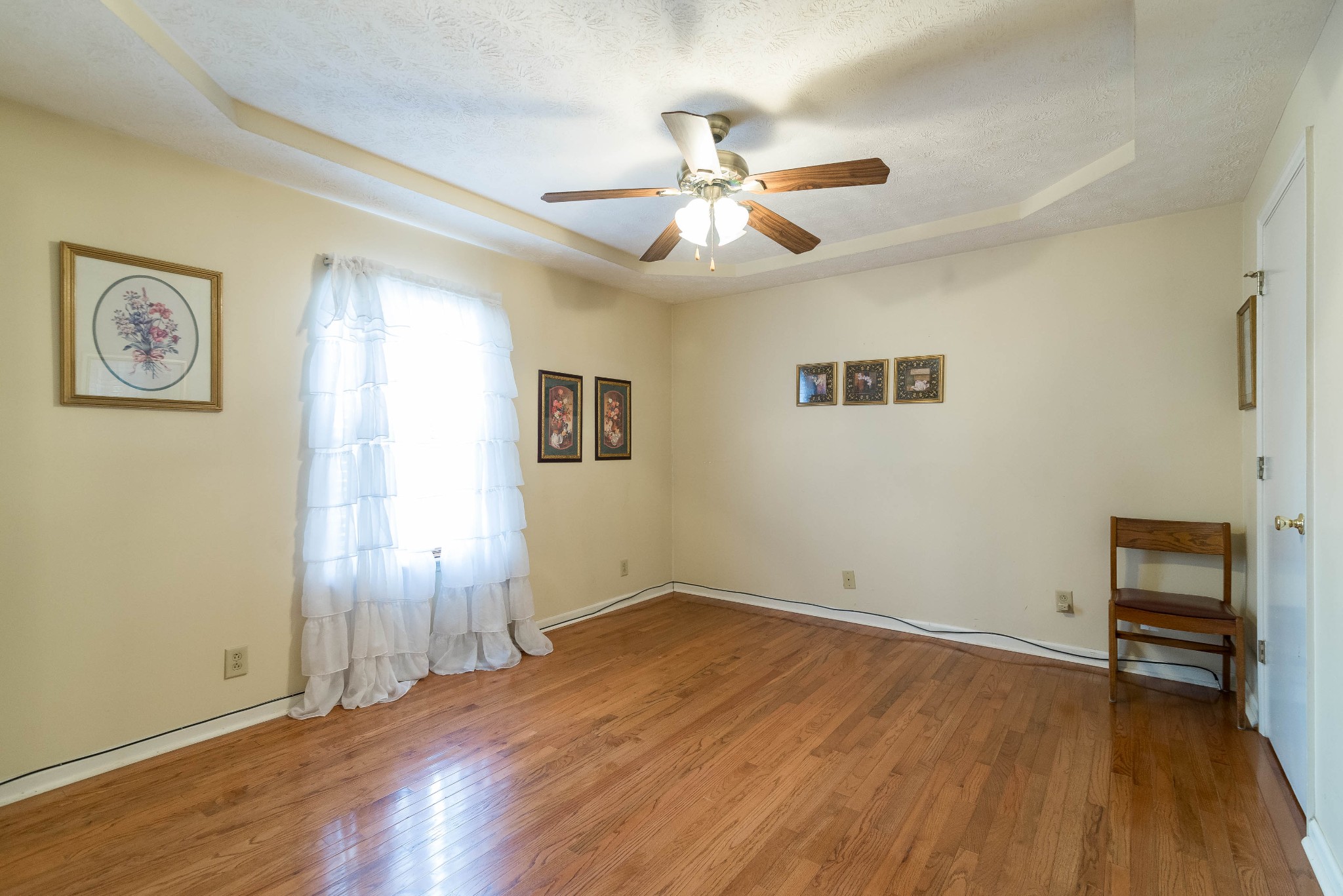 104 Brookside Point Springfield, TN 37172 - Photo 16 of 28 wooden floor in an empty room with a window