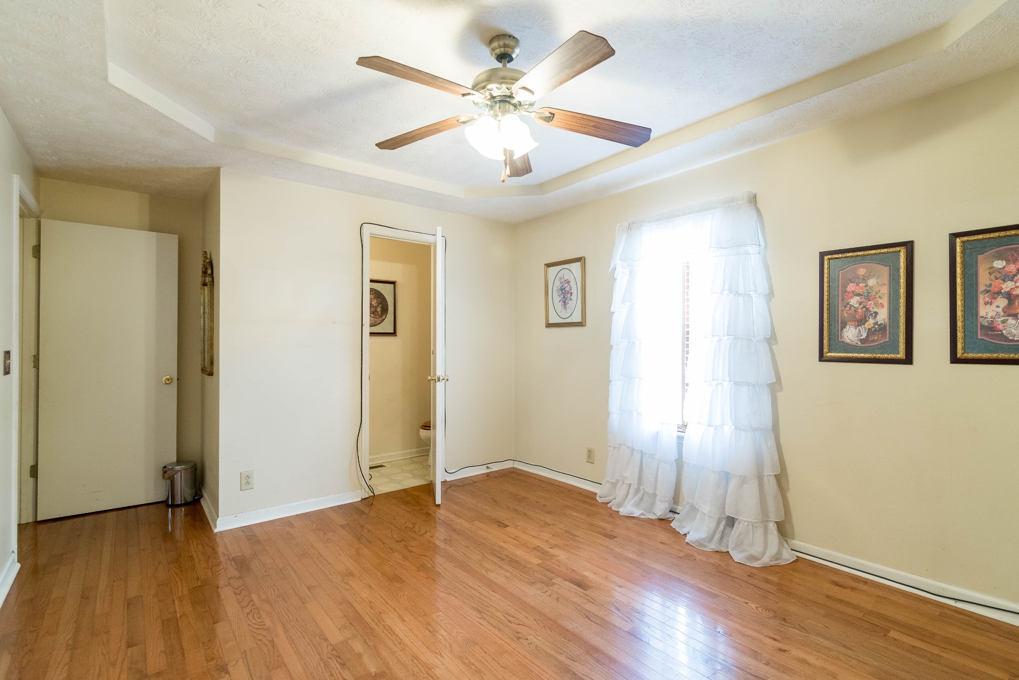 104 Brookside Point Springfield, TN 37172 - Photo 18 of 28 an empty room with wooden floor and ceiling fan