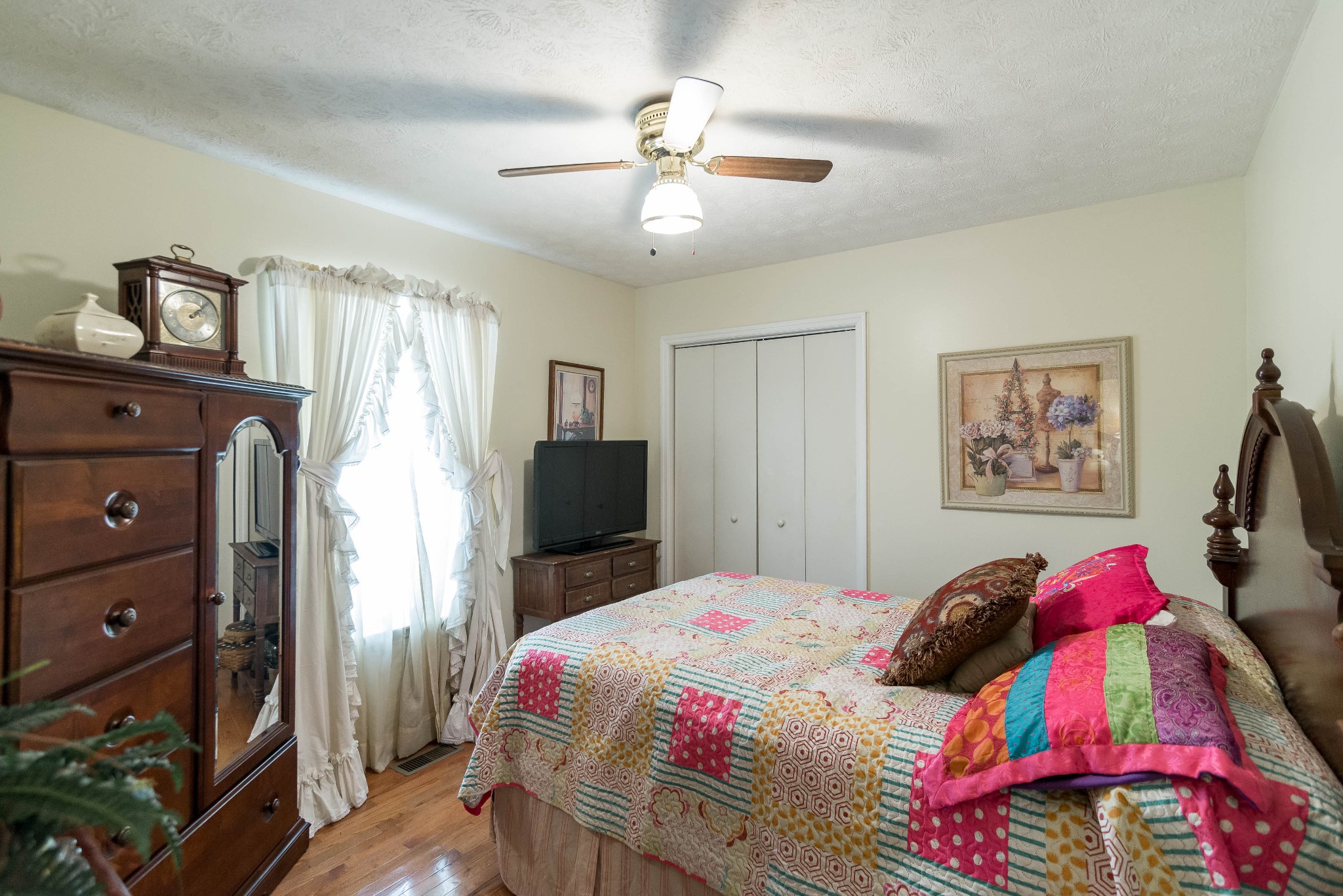 104 Brookside Point Springfield, TN 37172 - Photo 21 of 28 a bedroom with a bed and a chandelier