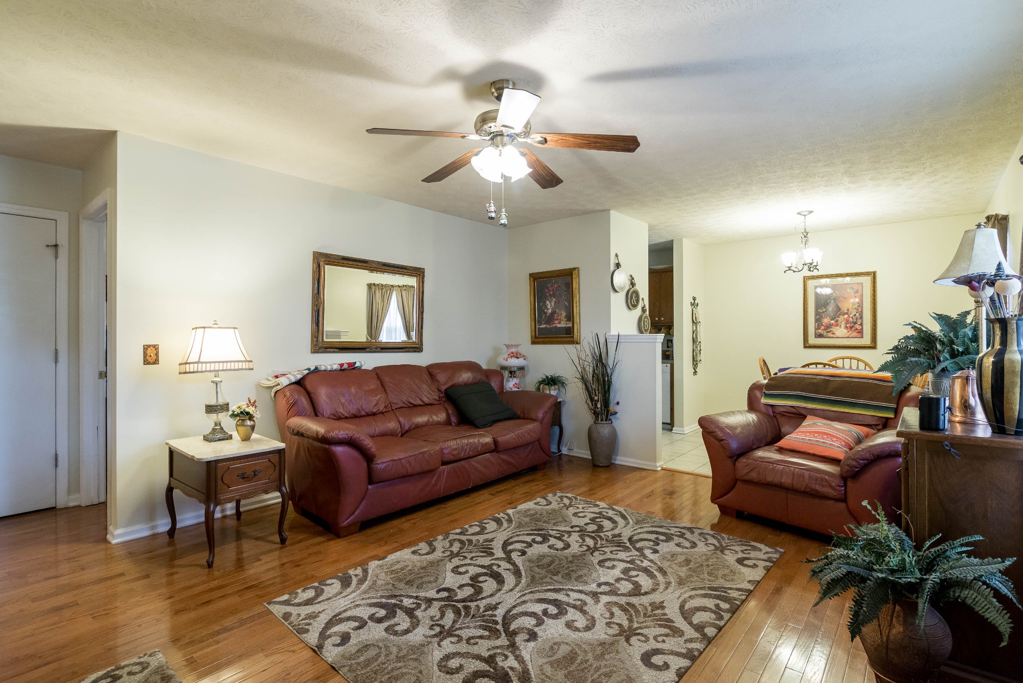 104 Brookside Point Springfield, TN 37172 - Photo 5 of 28 a living room with furniture and a chandelier