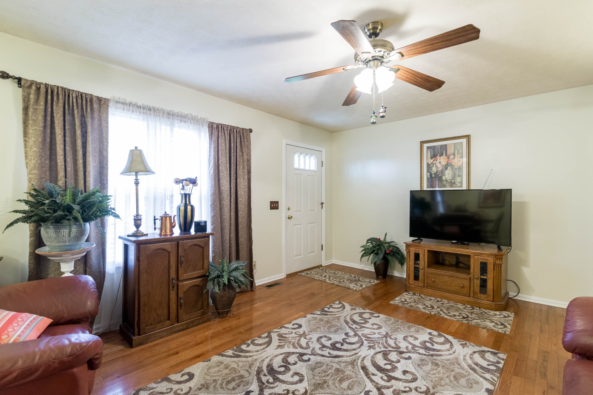 104 Brookside Point Springfield, TN 37172 - Photo 7 of 28 a living room with furniture and a flat screen tv