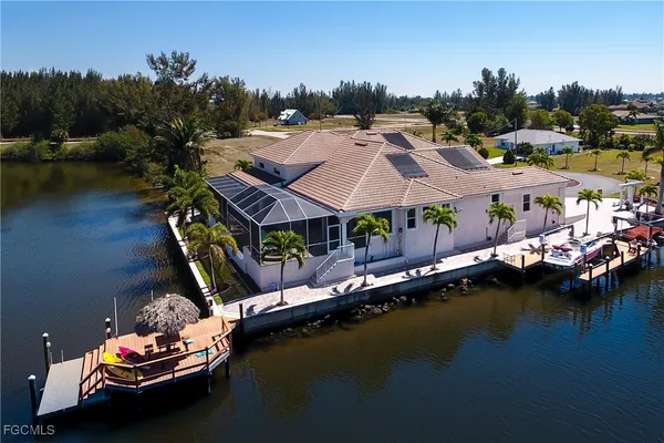 an aerial view of a house with a lake view