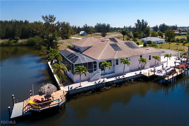 an aerial view of a house with a lake view