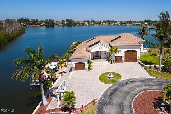 an aerial view of a house with outdoor space