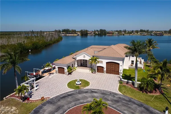 an aerial view of lake residential house with outdoor space