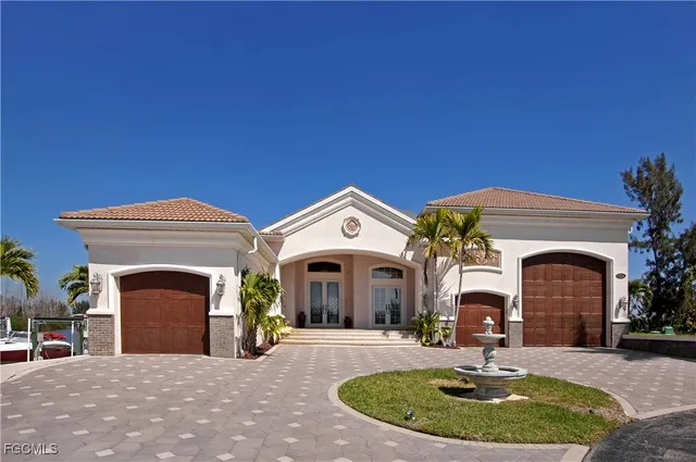 a living room with furniture a flat screen tv and kitchen view