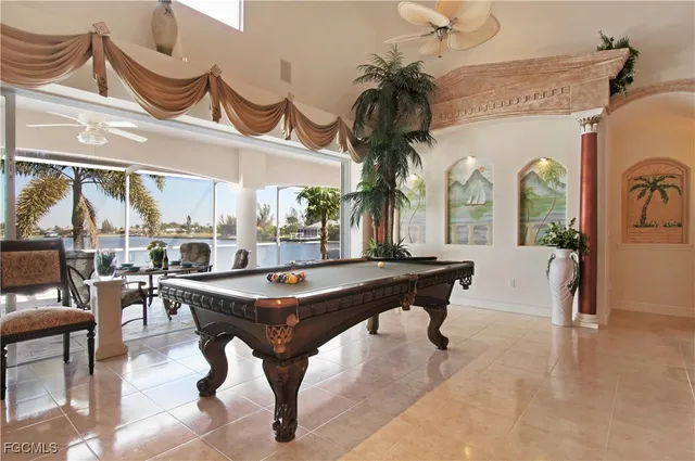 a room with lots of furniture and a chandelier