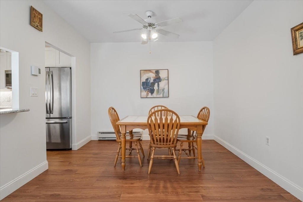 31 Hamlin Lane, Unit A14 Needham, MA 02492 - Photo 13 of 23 a view of a dining room with furniture and wooden floor