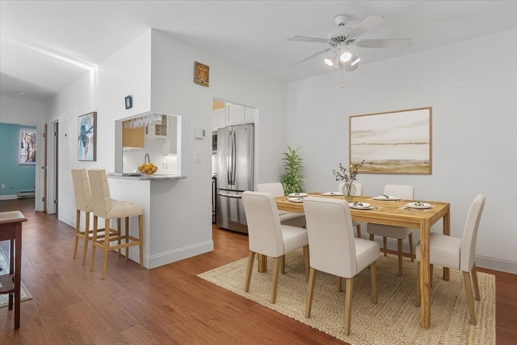 31 Hamlin Lane, Unit A14 Needham, MA 02492 - Photo 14 of 23 a view of a dining room with furniture and wooden floor