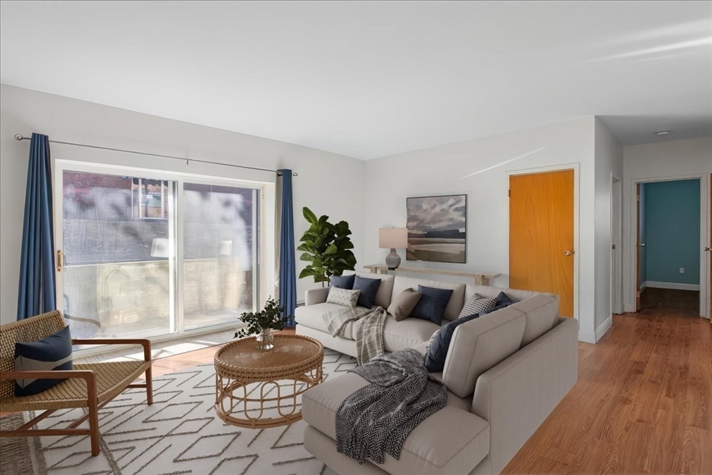 31 Hamlin Lane, Unit A14 Needham, MA 02492 - Photo 16 of 23 a living room with furniture and a large window