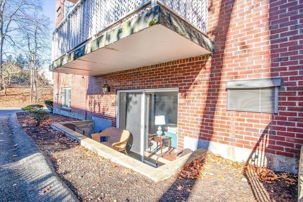 31 Hamlin Lane, Unit A14 Needham, MA 02492 - Photo 23 of 23 a view of a house with a patio