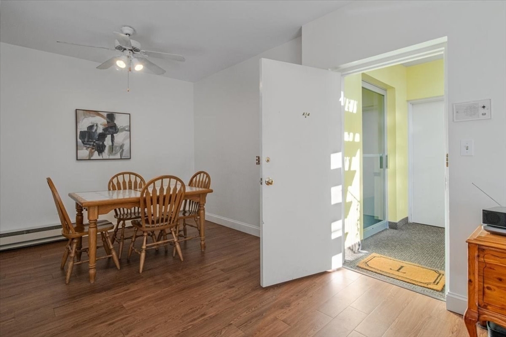 31 Hamlin Lane, Unit A14 Needham, MA 02492 - Photo 5 of 23 a view of a dining room with furniture and wooden floor