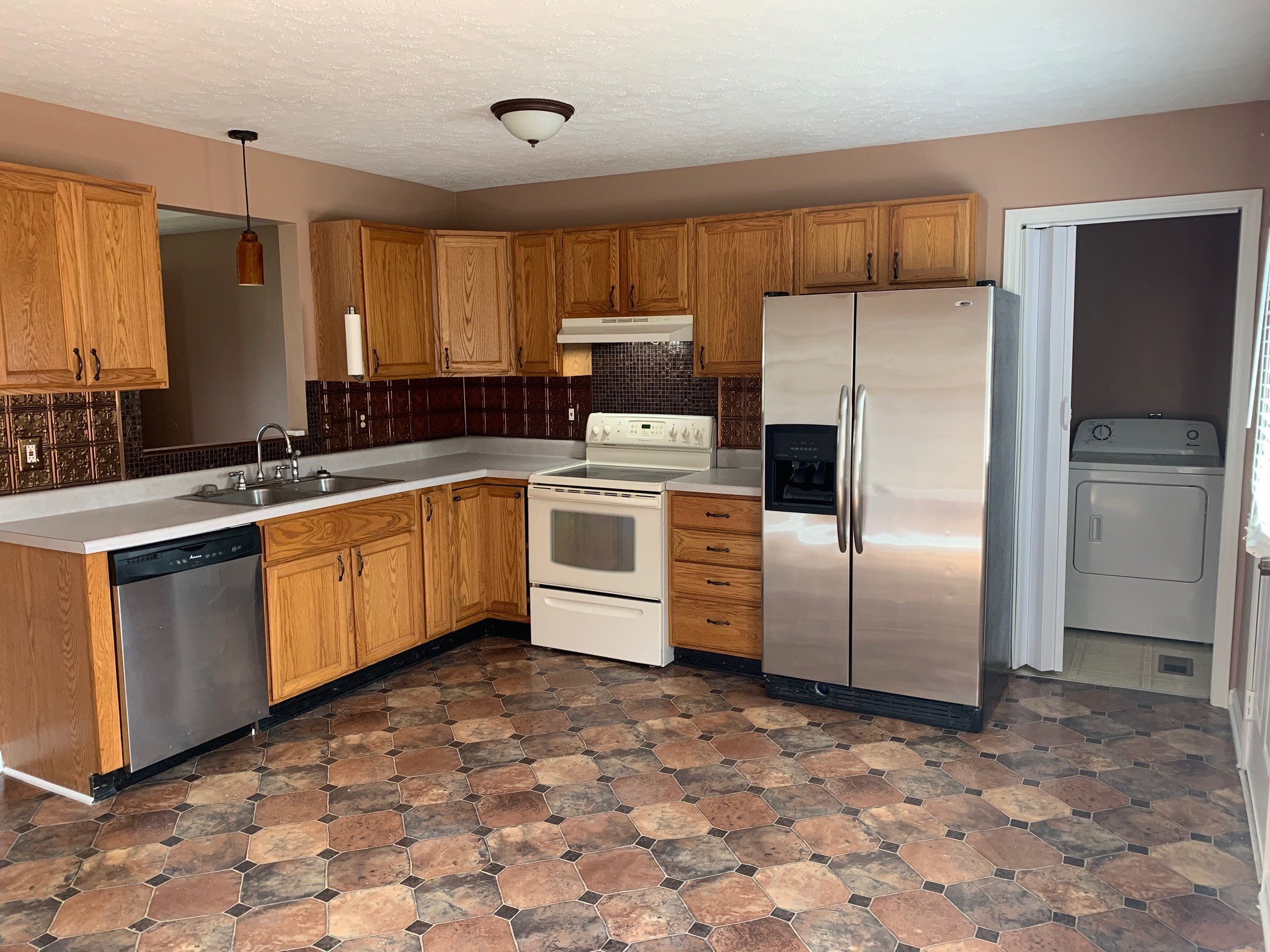 5520 Old Rome Pike Lebanon, TN 37087 - Photo 3 of 14 a kitchen with a sink a refrigerator and cabinets