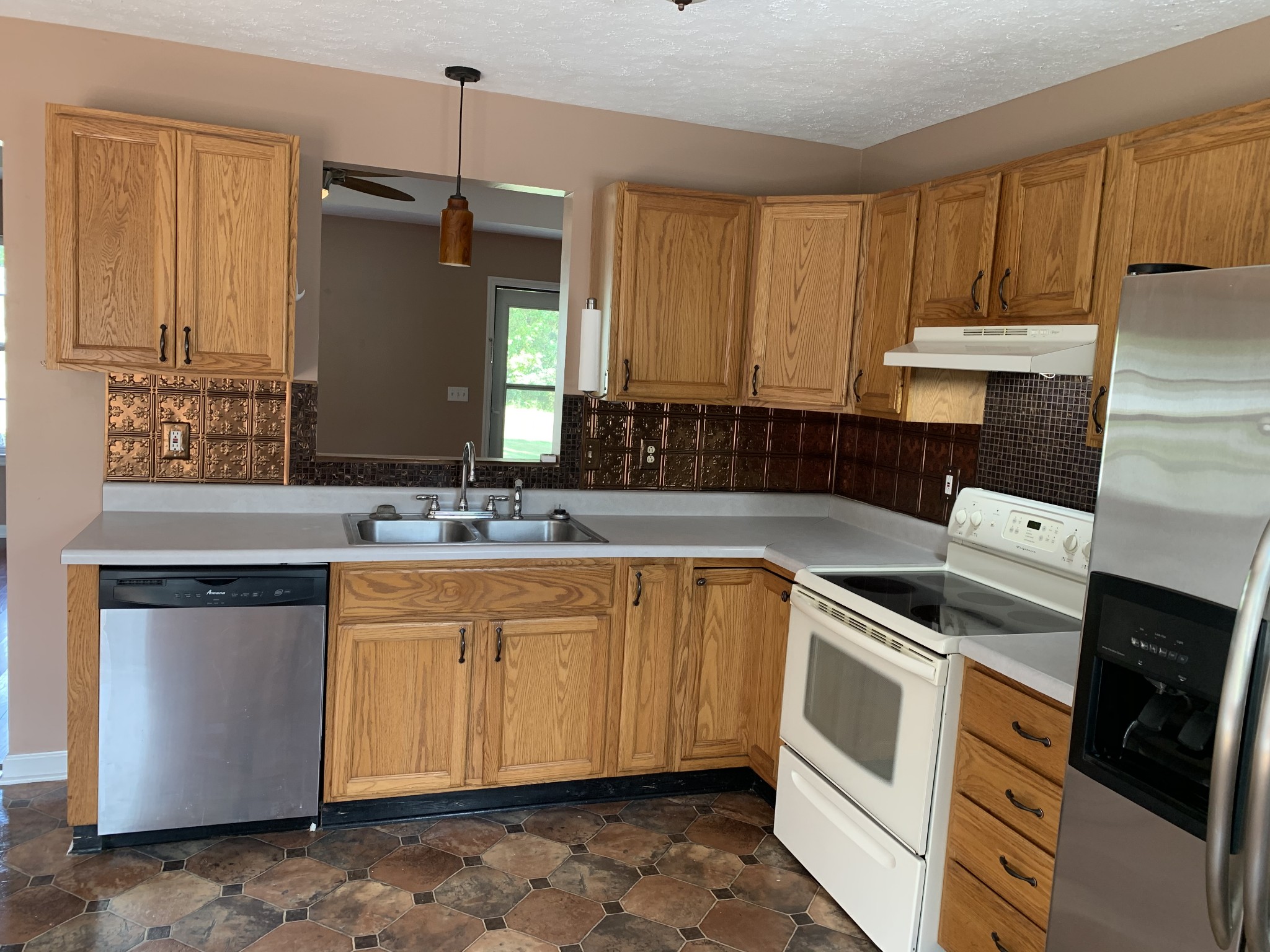 5520 Old Rome Pike Lebanon, TN 37087 - Photo 4 of 14 a kitchen with stainless steel appliances granite countertop a sink stove and refrigerator