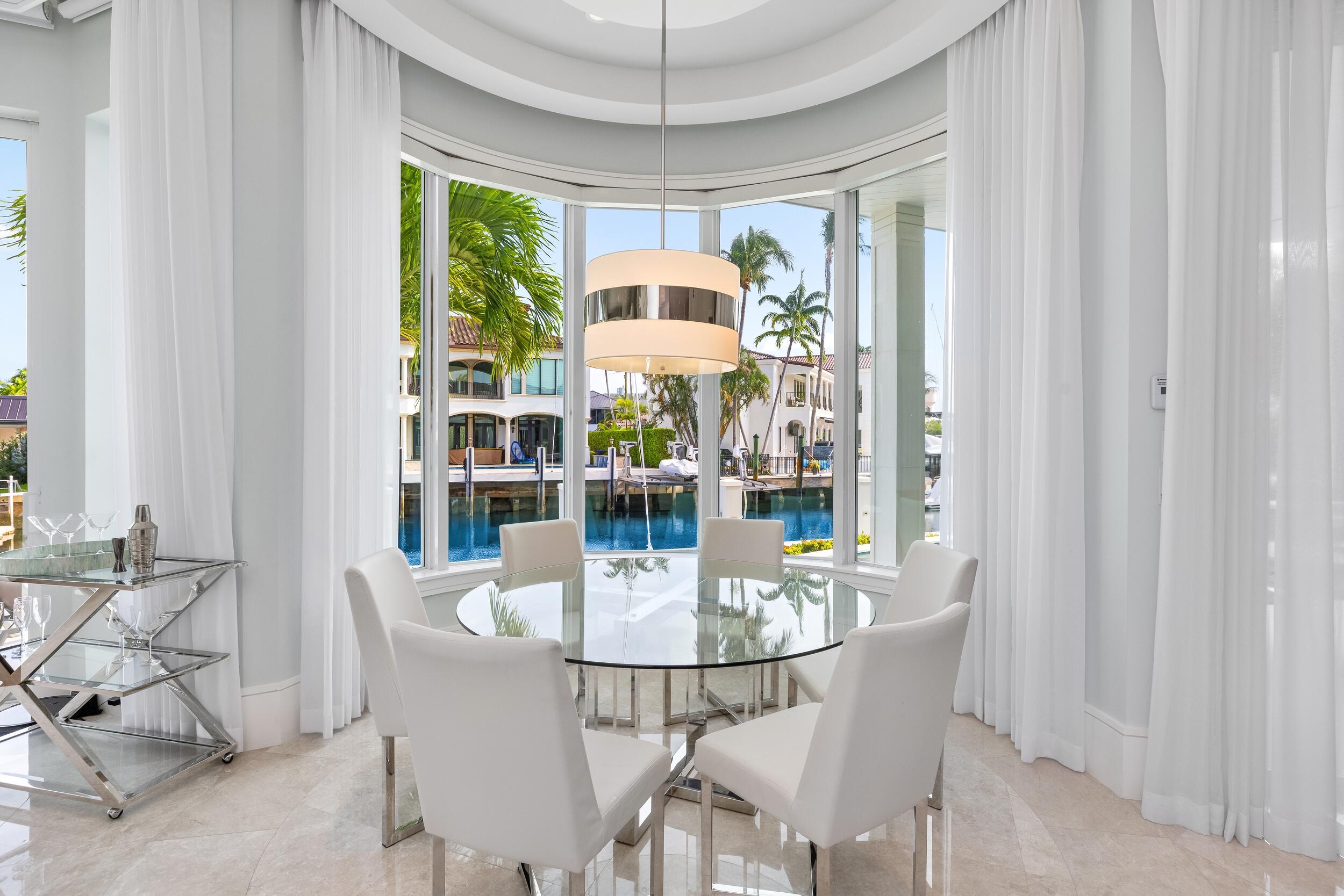 863 Enfield Street Boca Raton, FL 33487 - Photo 30 of 67 a dining room with furniture a chandelier and window