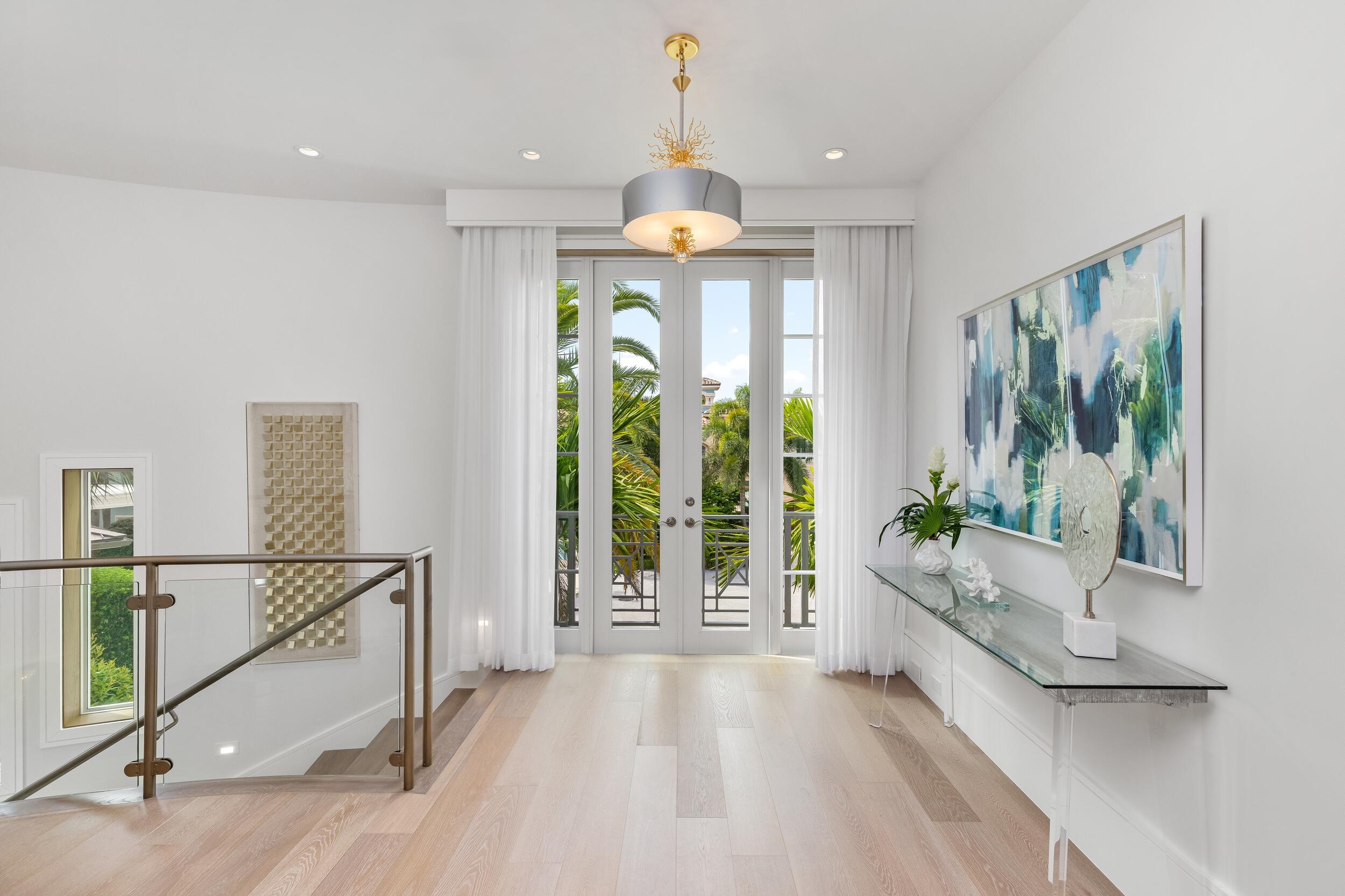 863 Enfield Street Boca Raton, FL 33487 - Photo 36 of 67 a view of an entryway with wooden floor and windows
